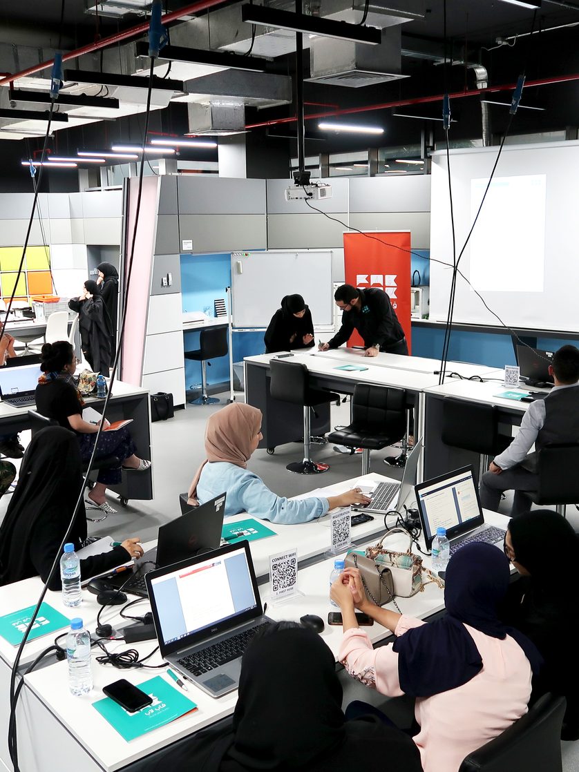 Users working at the benches inside the QBIC Fab Lab